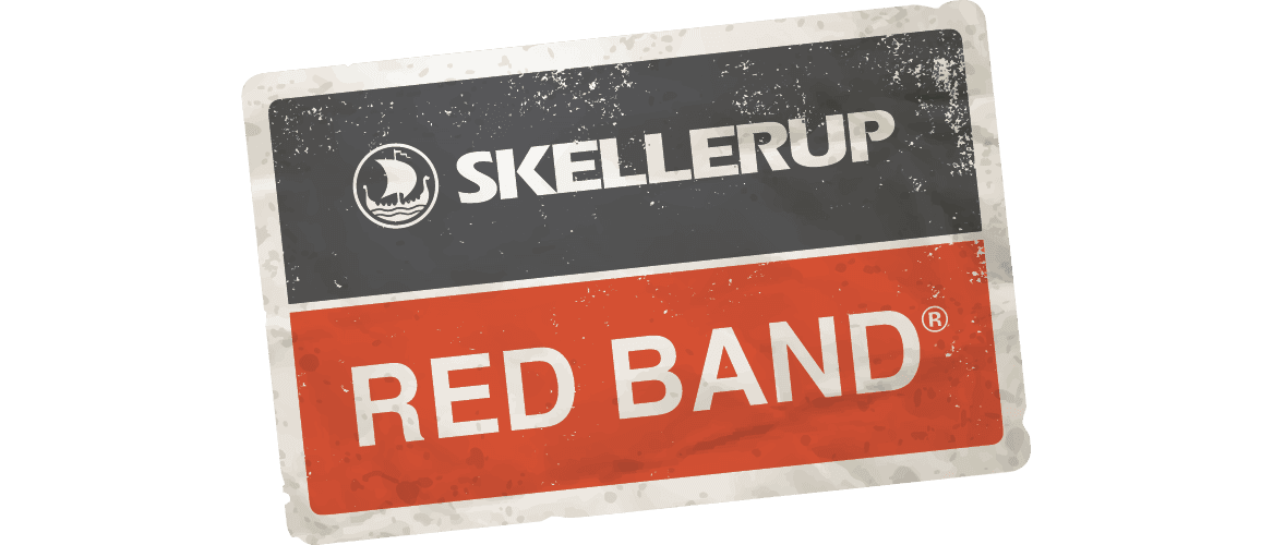 A weathered rectangular sign with a black top section displaying SKELLERUP and a white logo, and a red bottom section with RED BAND® in bold white text.