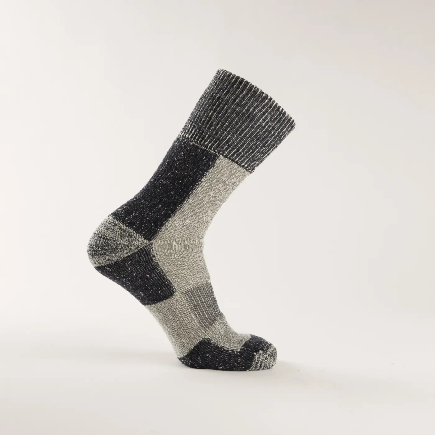 A single gray and black wool sock with a block pattern, displayed upright on a plain white background.