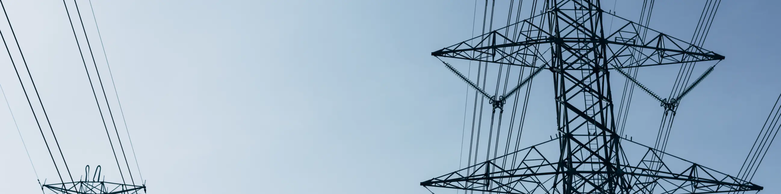 High voltage power lines blue sky