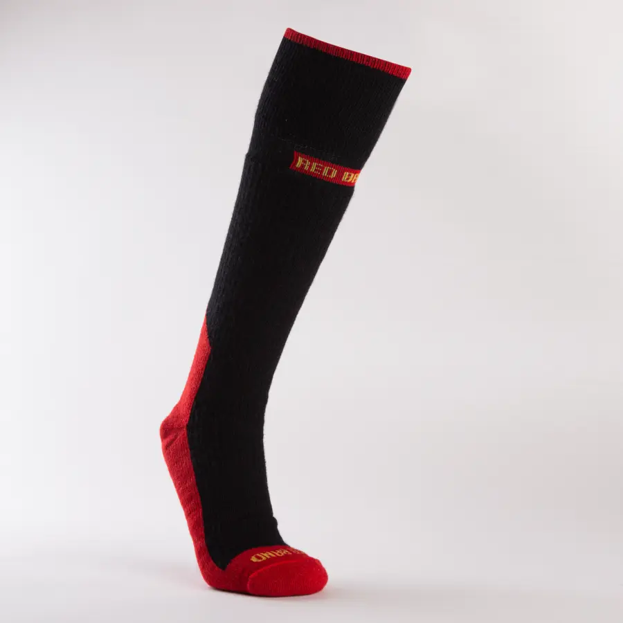A single black and red knee-high sock with RED DRAGON written in yellow on the calf area and ENDURANCE in yellow on the toe, displayed upright against a plain white background.