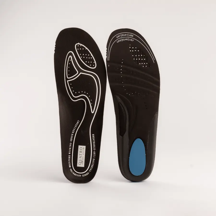A pair of black orthotic shoe insoles is displayed upright against a white background. One insole shows a white outline design on top; the other reveals a blue cushioned pad and perforations on the underside.