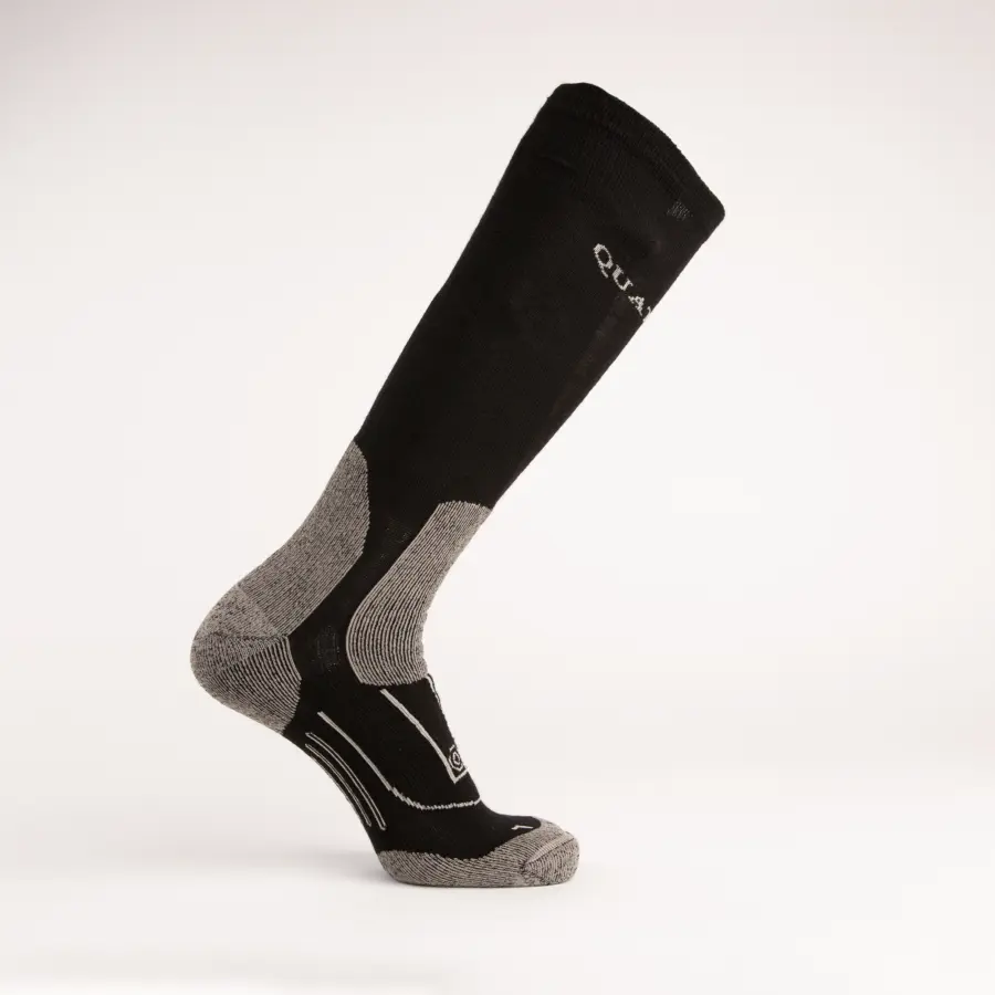 A single black and gray knee-high sock with cushioned gray toe, heel, and arch areas, displayed standing upright on a white background.