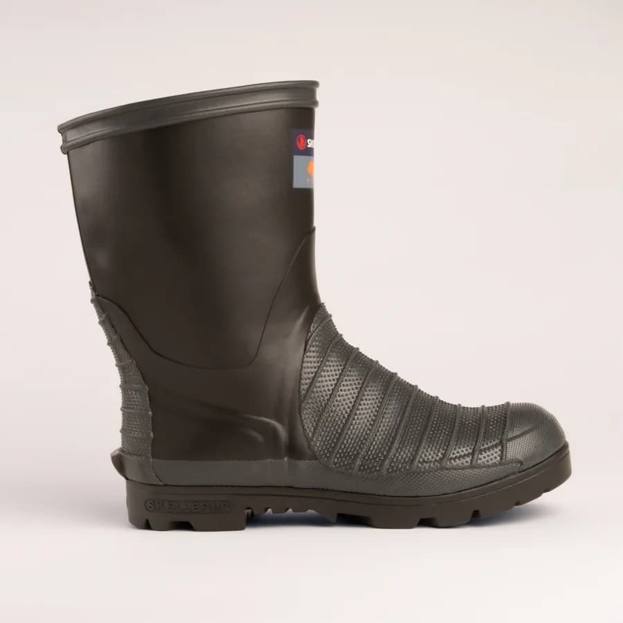 A single black rubber work boot with textured detailing, thick sole, and a partial label near the top, displayed against a plain light background.