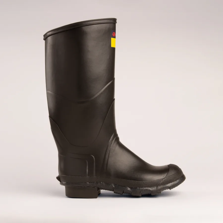 A single black rubber rain boot with a textured sole, shown in profile on a plain light background. There is a small yellow and red label near the top of the boot.