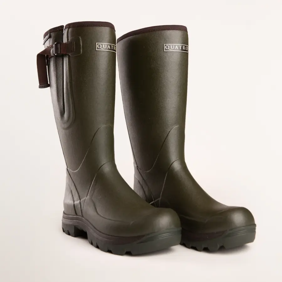 A pair of dark green rubber boots with thick black soles, a side buckle near the top, and QUATRO labels on the front, displayed on a plain light background.