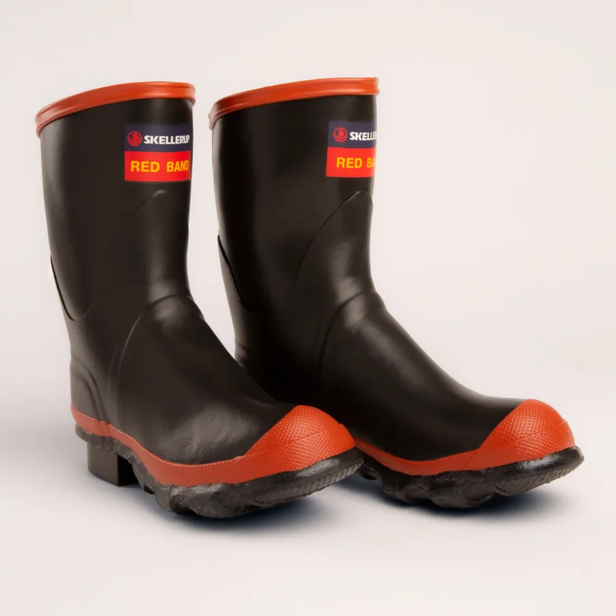 A pair of black rubber boots with red soles, red trim at the top, and a label reading Red Band on each boot, photographed against a plain white background.