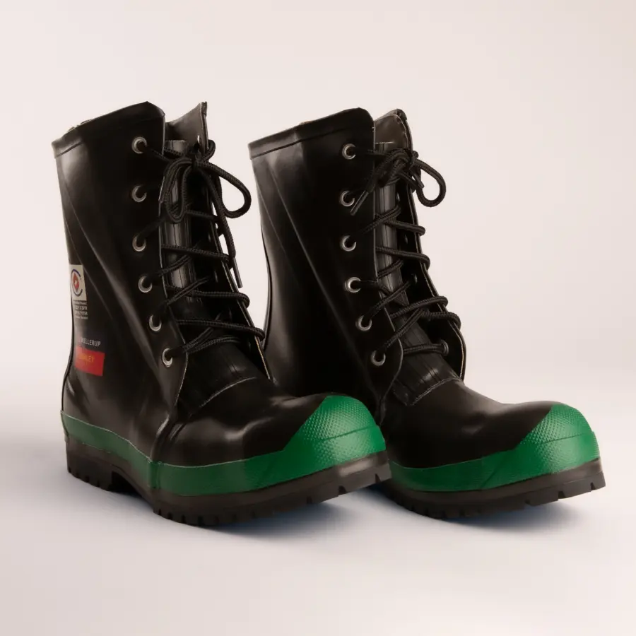 A pair of black lace-up work boots with green reinforced rubber toes and rugged soles, displayed on a plain white background.